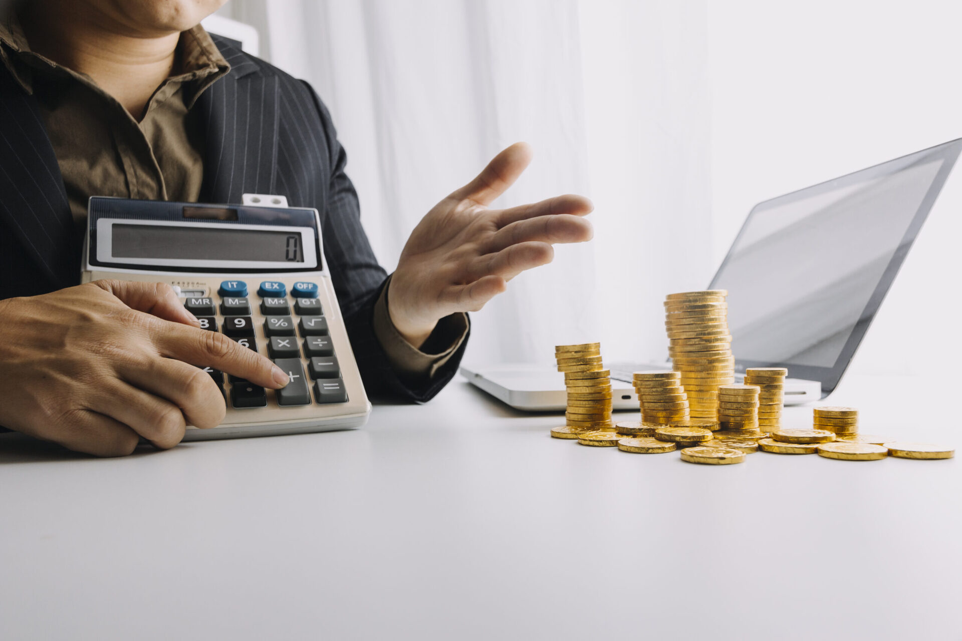 Business accounting concept, Business man using calculator with